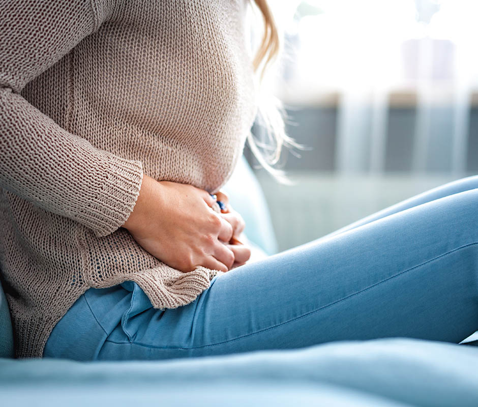 Young woman suffering from period pain